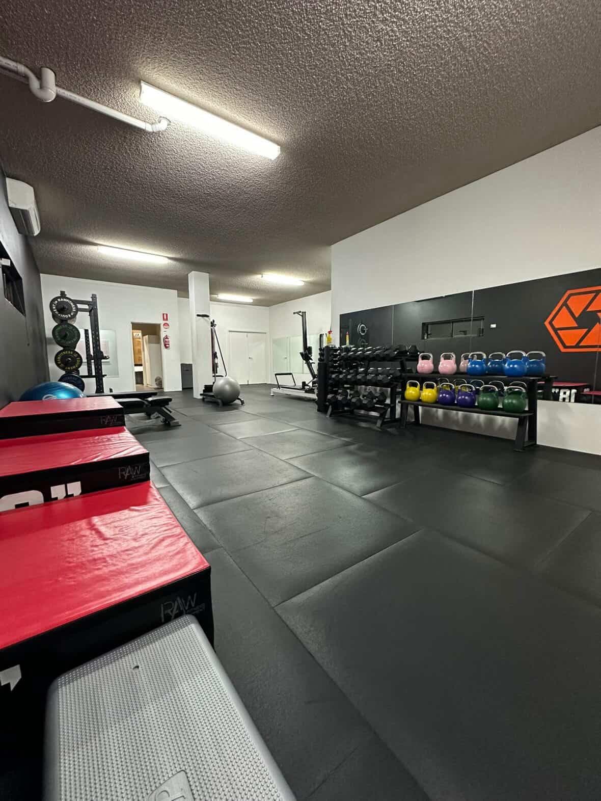 HEXA Health Hub rehabilitation gym — kettlebells and equipment